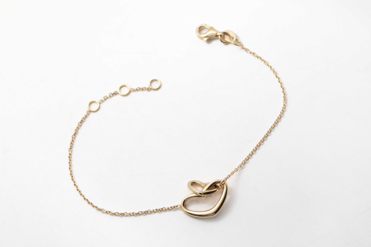 Pulsera dos corazones cruzados